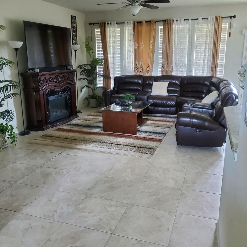 A living room filled with furniture and a fireplace