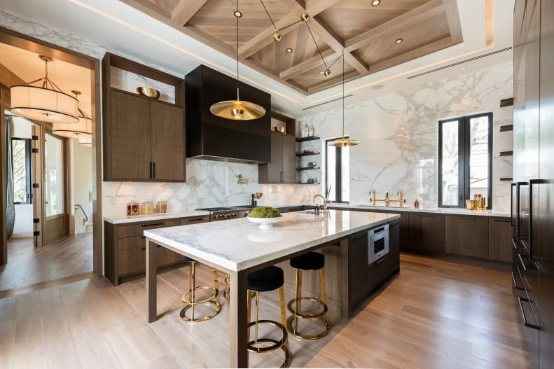 There is a large island in the middle of the kitchen.