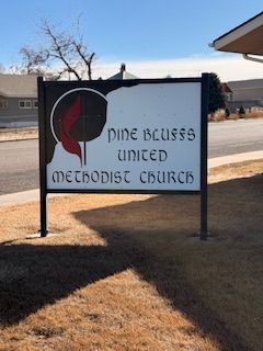 Church sign at the corner of Main Street and 6th Street.