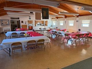 Fellowship hall looking from the front door entry way to the kitchen.