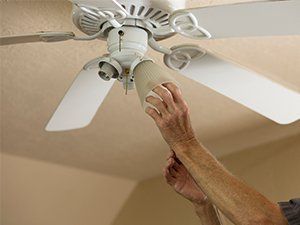 Electrician Repairing Ceiling Fan — Spring, TX — Anthony Electric Company, LLC