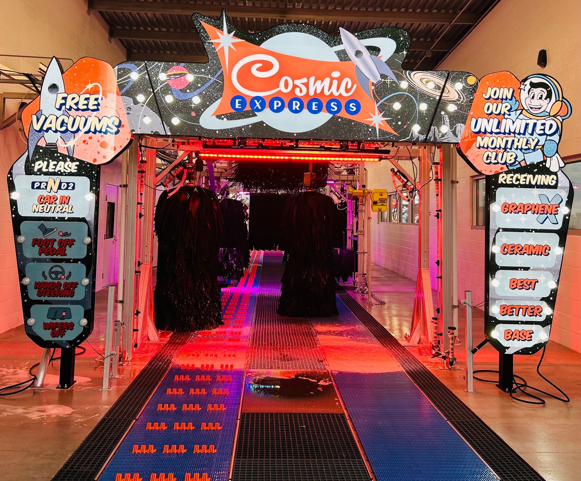 A car wash with a sign that says cosmic express