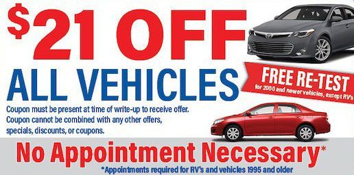 A sign that says $ 21 off all vehicles free re-test no appointment necessary