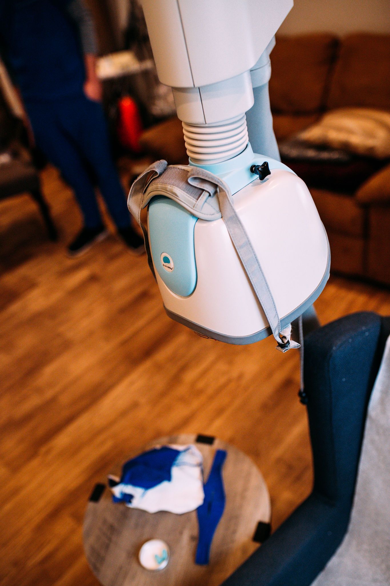 A person is sitting in a chair with a machine attached to it.