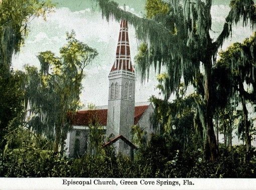 Episcopal Church in Green Cove Springs, Florida, with tall white steeple, red roof, and trees draped with Spanish moss.