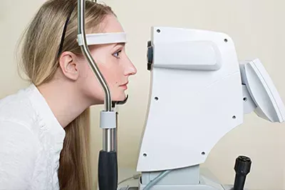 Lady getting an eye exam