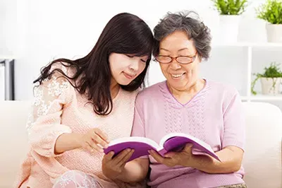 Mother and daughter reading a book