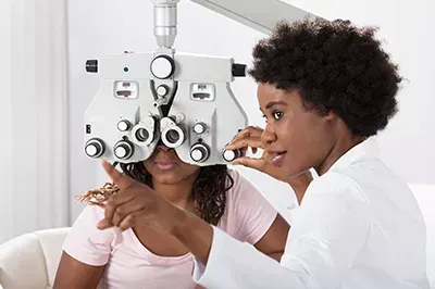 Eye doctor doing an ophthalmology comprehensive eye exam