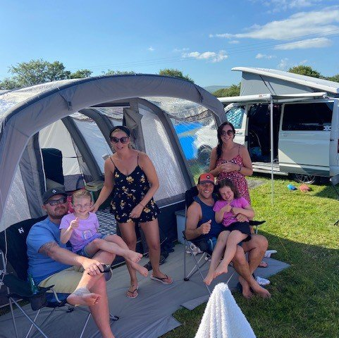 Family enjoying breakfast outside of a Static Caravan in Pennymoor Caravan and Camping Park