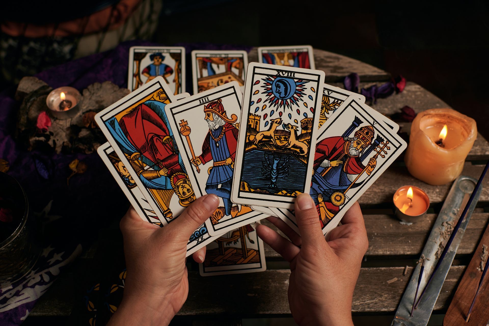A Person Holding A Tarot Cards — Tampa, FL — Psychic Maya