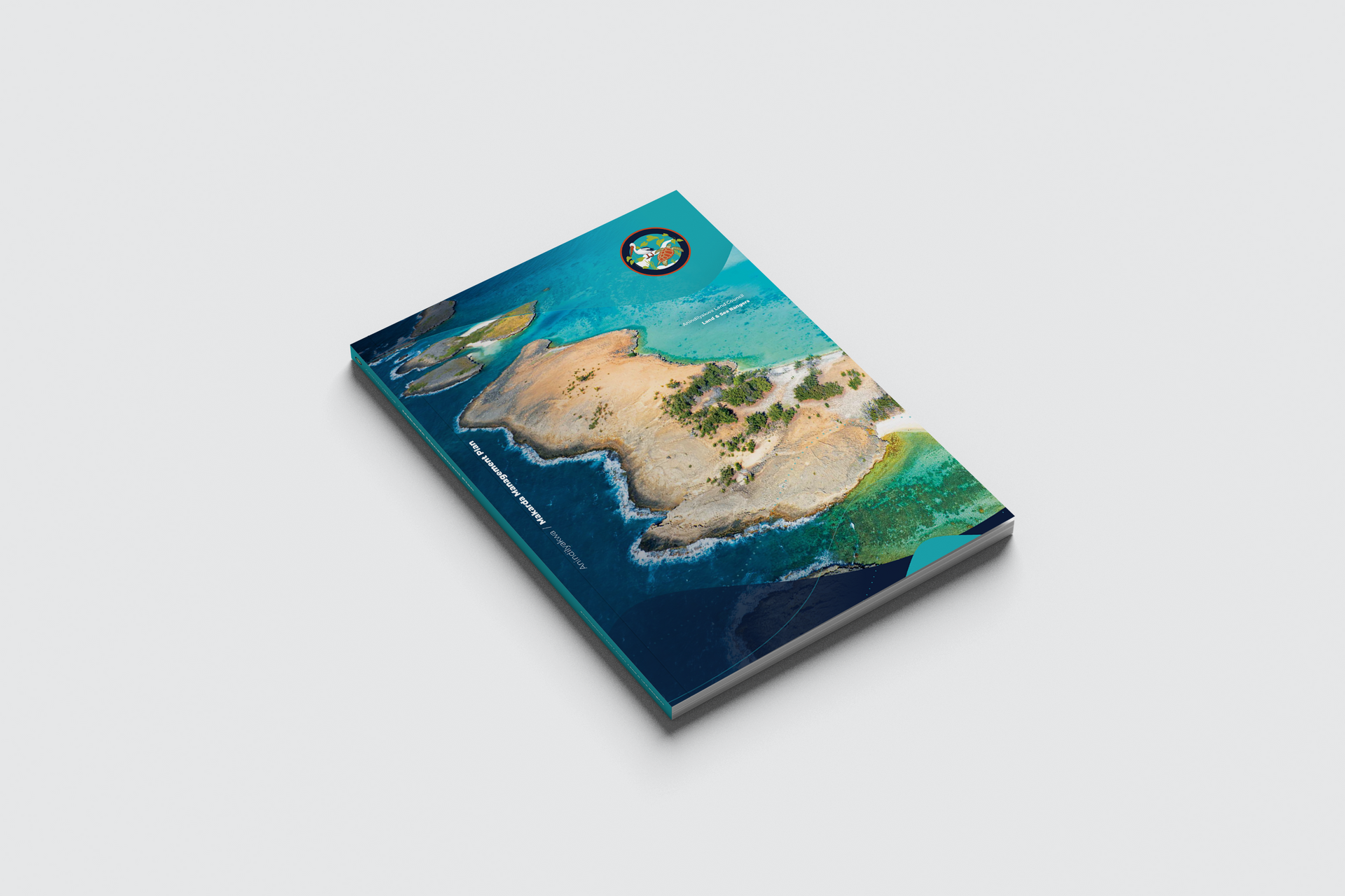 A book with an aerial view of a small island in the middle of the ocean.