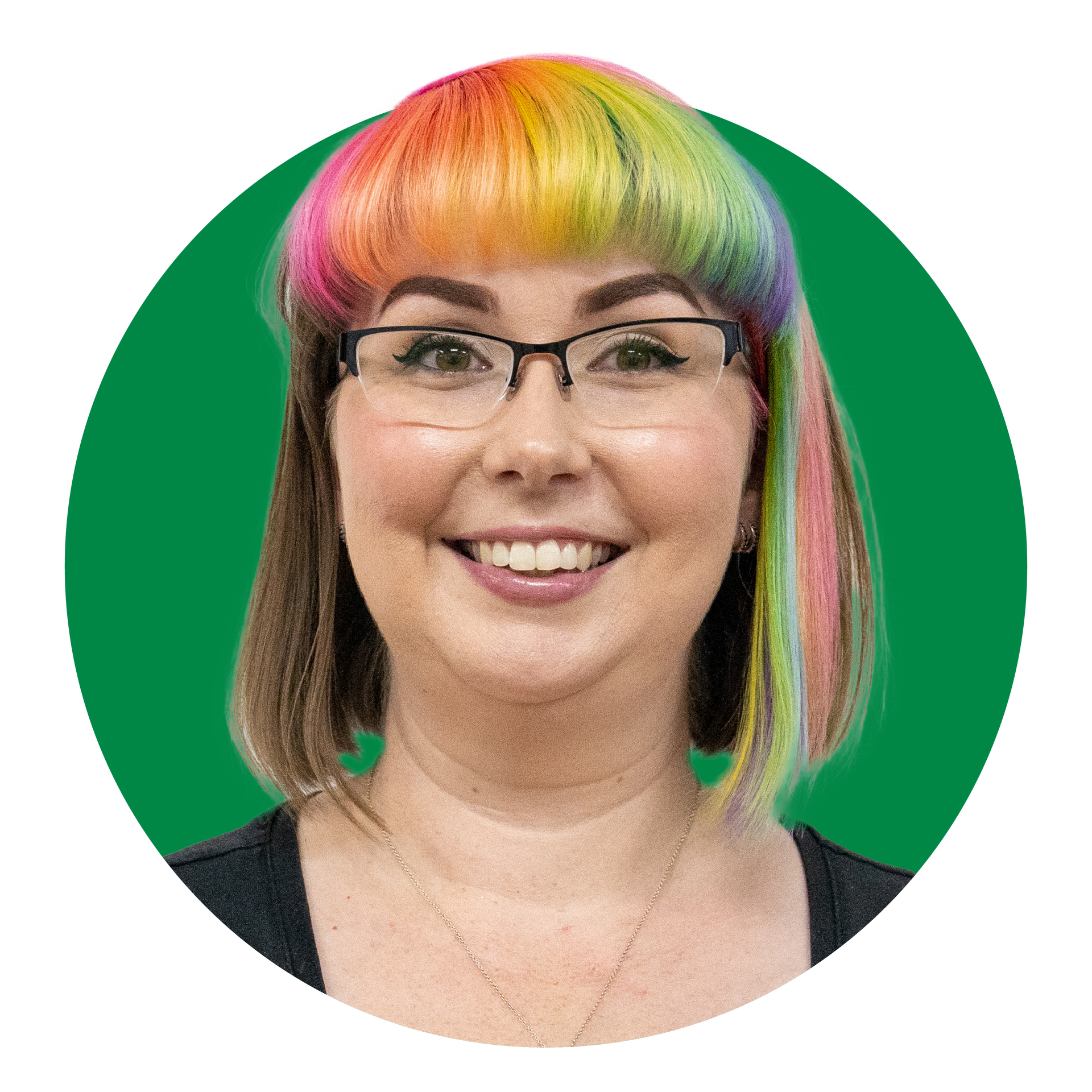 A woman with glasses and rainbow hair is smiling in a green circle