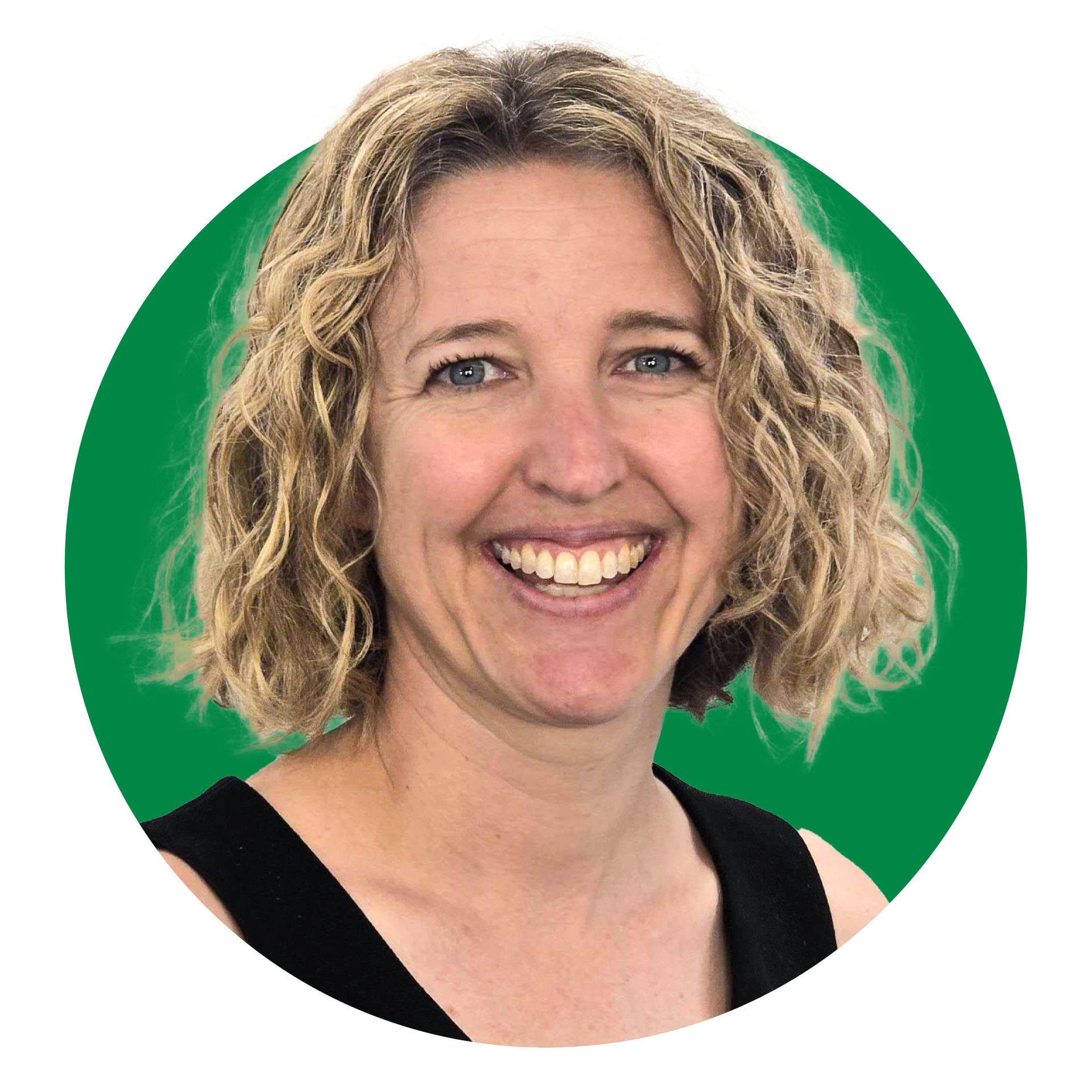 A woman in a black shirt is holding a green spoon