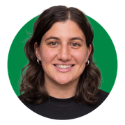 A woman in a black shirt is smiling in a green circle.