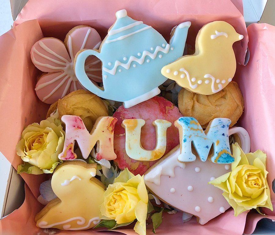 A white plate topped with noodles asparagus and tomatoes