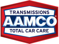 AAMCO logo: red hexagon frame with a blue and white text reading "TRANSMISSIONS AAMCO TOTAL CAR CARE".
