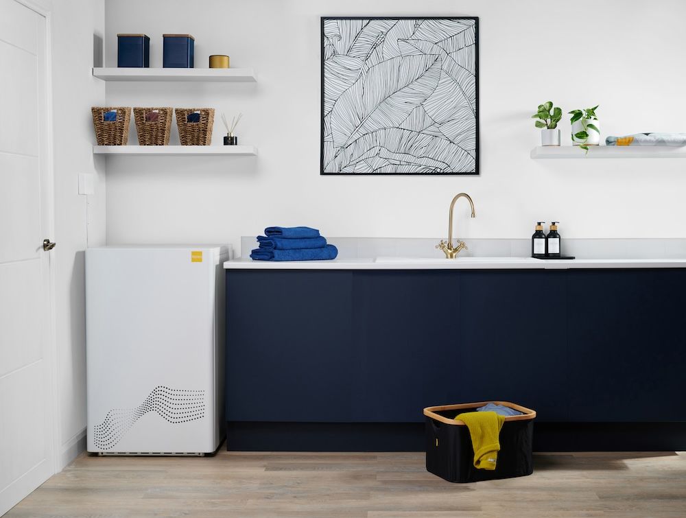 A cardboard box on a dolly in a kitchen