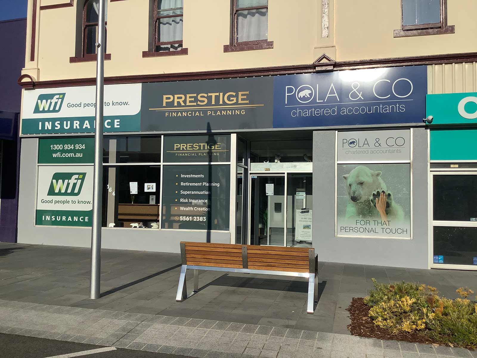 A Building With A Sign That Says Prestige On It — Pola & Co In Warrnambool, VIC