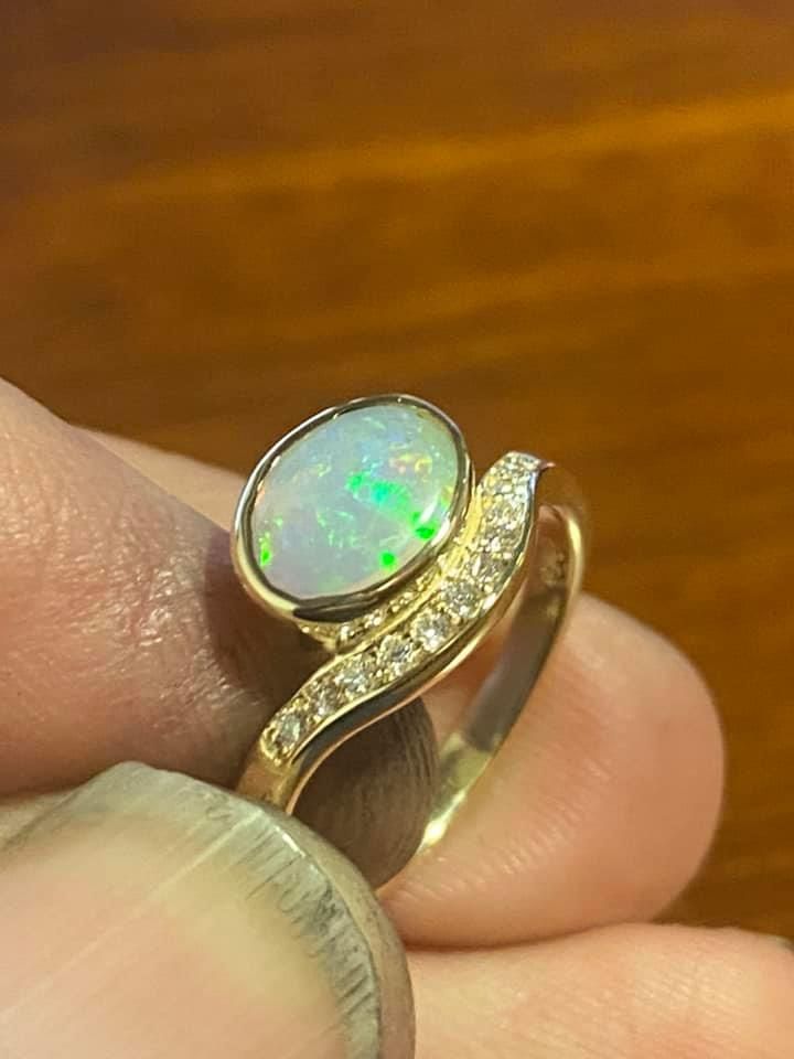 Gold Ring With Oval Opal Gemstone and Diamond Accents — Regency Jewellers in Cairns City, QLD