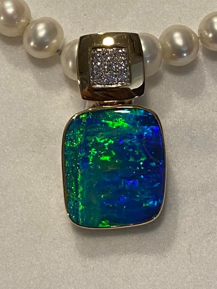 Opal Pendant With Blue and Green Iridescence, Set in Gold and Diamond Accent — Regency Jewellers in Cairns City, QLD