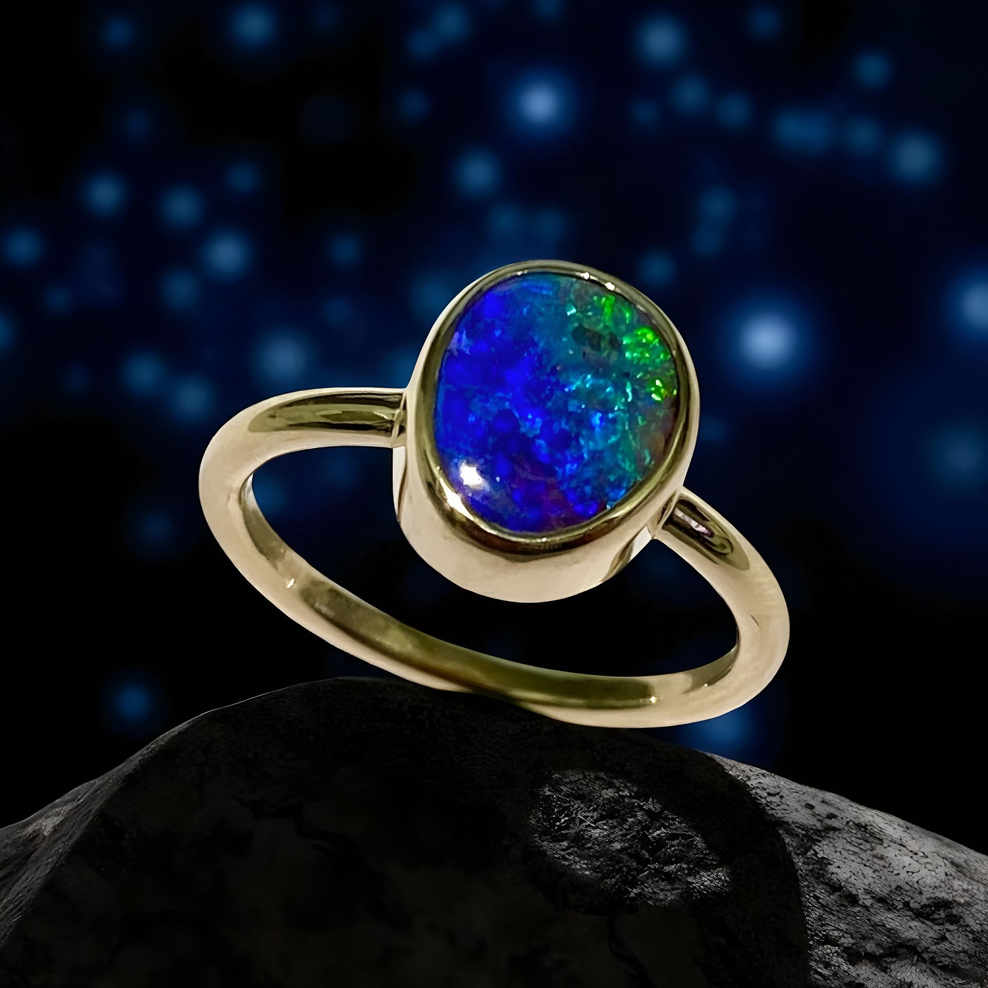 Silver Ring With a Rectangular Opal Gemstone, Displaying Blue and Green Hues — Regency Jewellers in Cairns City, QLD
