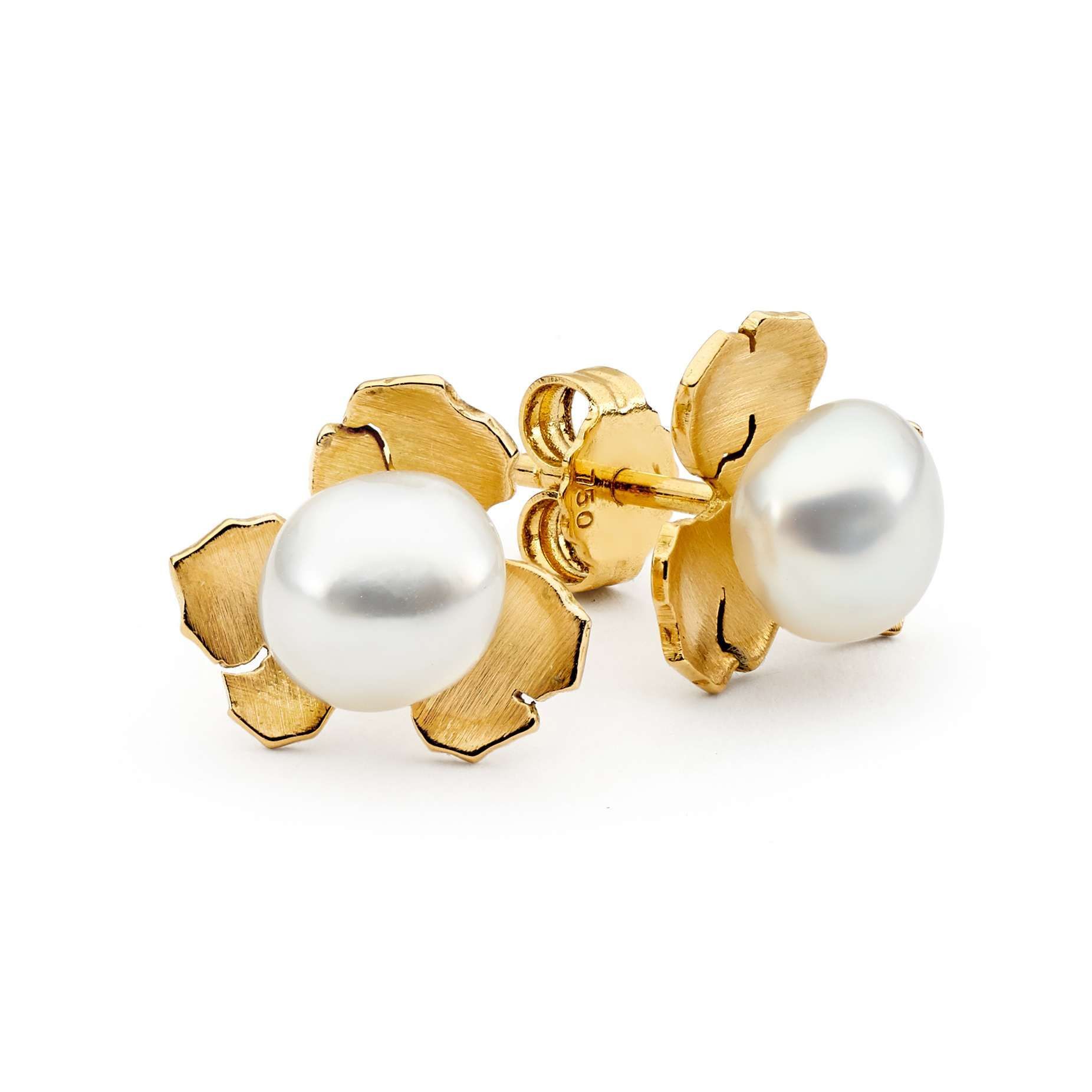 Pearl Necklace and Earrings Resting on Gray Stones — Regency Jewellers in Cairns City, QLD