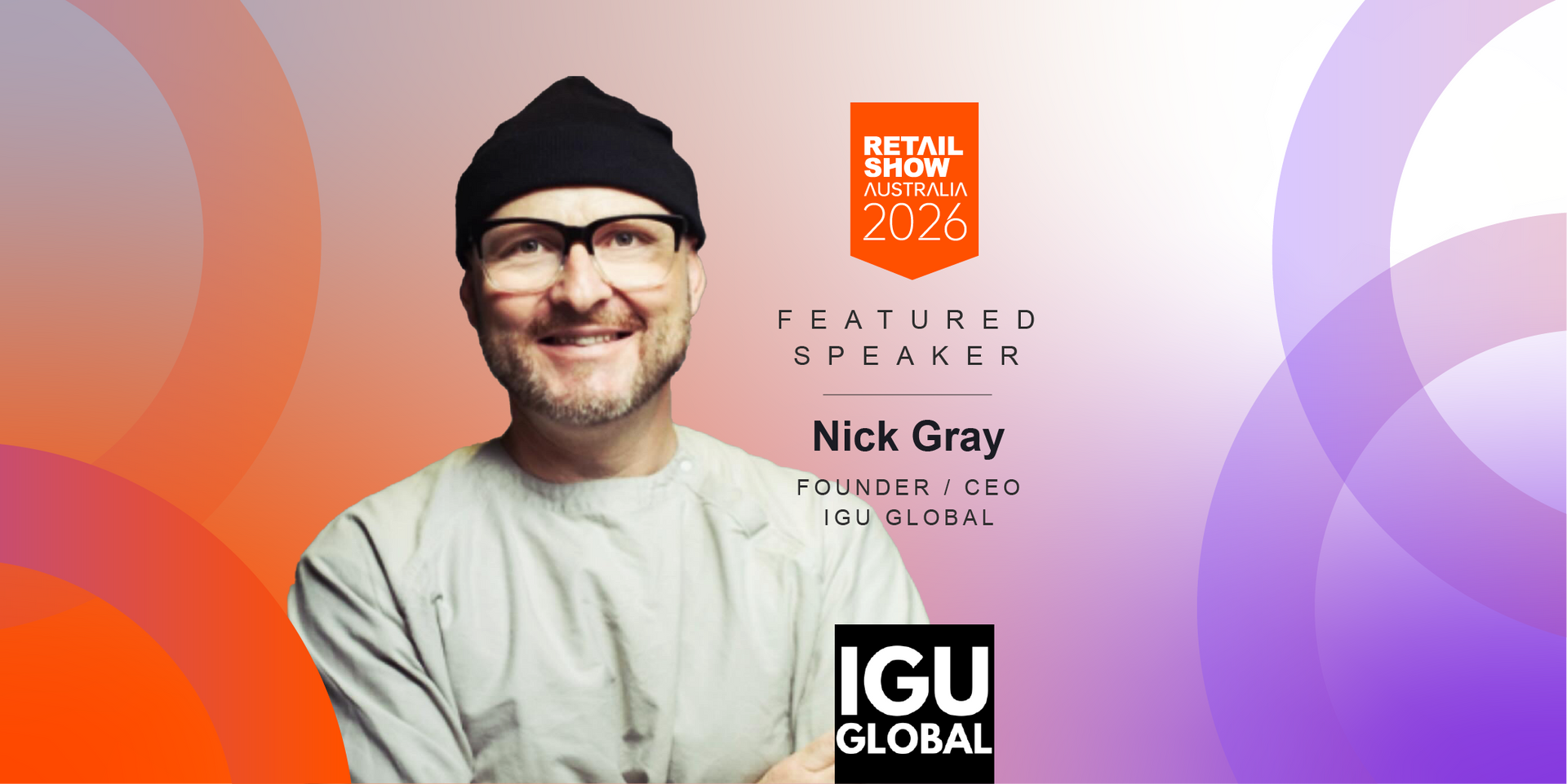 Speaker Nick Gray, wearing glasses and a black hat, smiles against an orange and purple background.