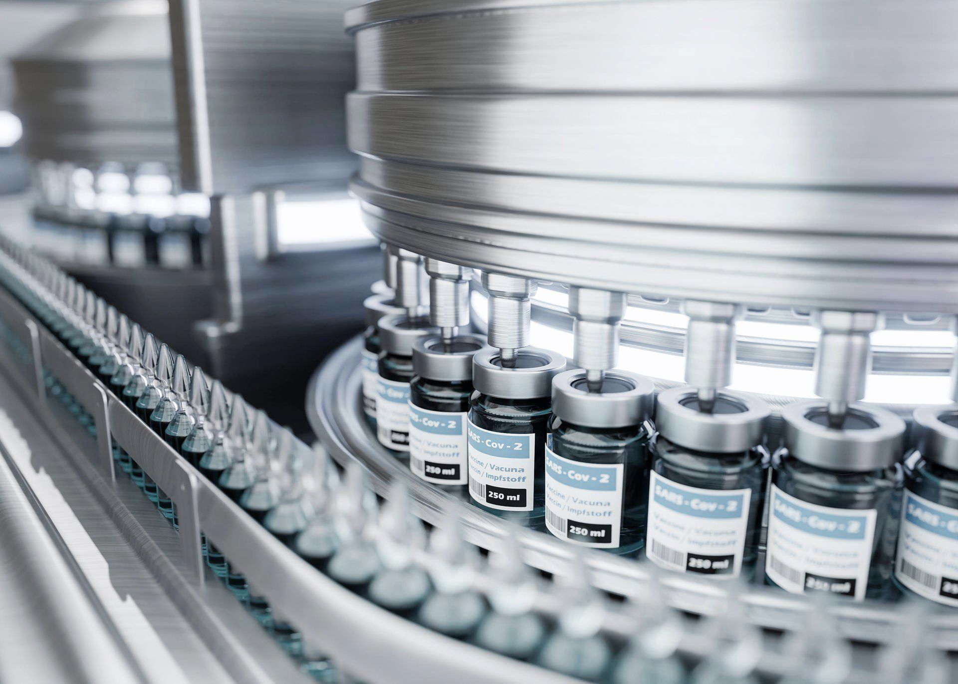 A conveyor belt is filled with bottles of vaccine