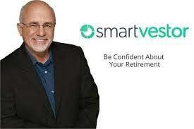 A man in a suit is standing in front of a smartvestor logo.
