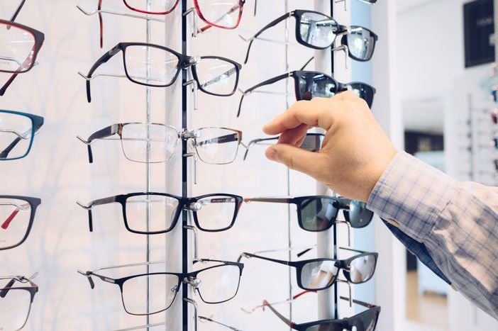 Customer Choosing Glasses — Wilbraham, MA — Spectacle Shoppe of Wilbraham