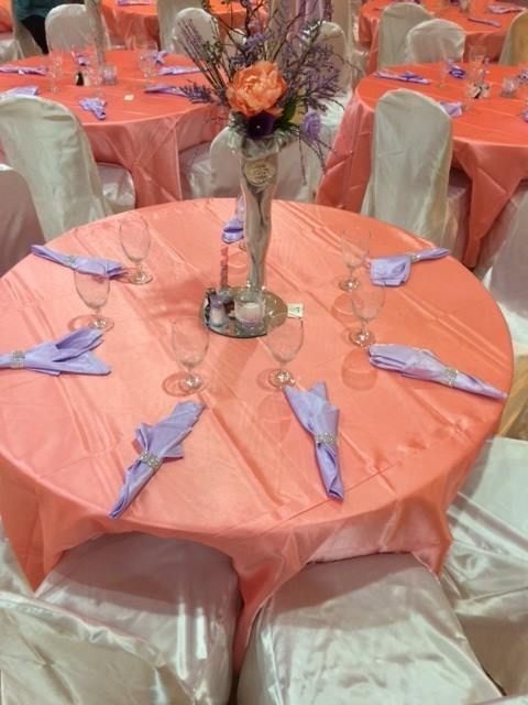 A table with a vase of flowers on it