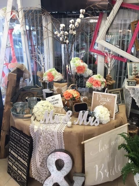 A table with a sign that says mr. and mrs. on it