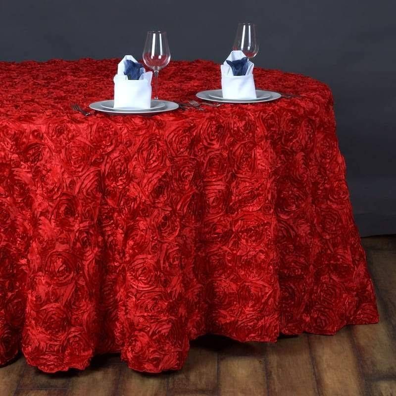 A table with a red tablecloth and two glasses on it