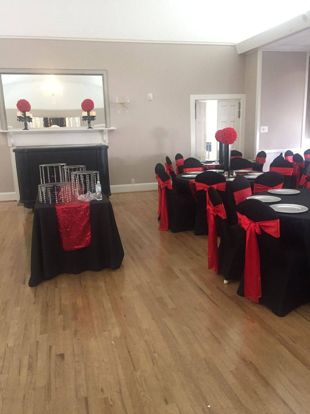 A room with tables and chairs set up for a party
