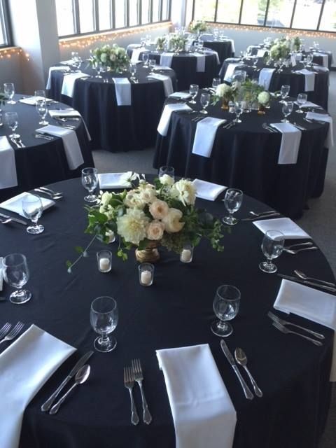 A table with a vase of flowers on it