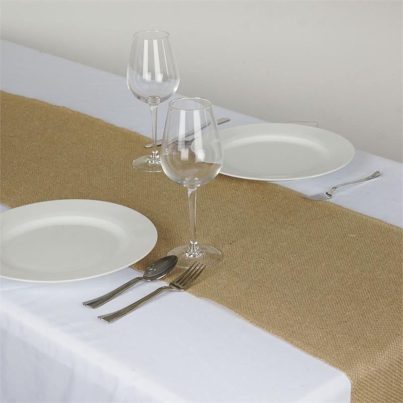 A table with plates and wine glasses on it