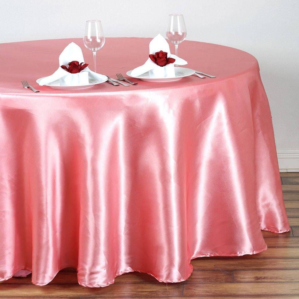 A round table with a pink satin table cloth