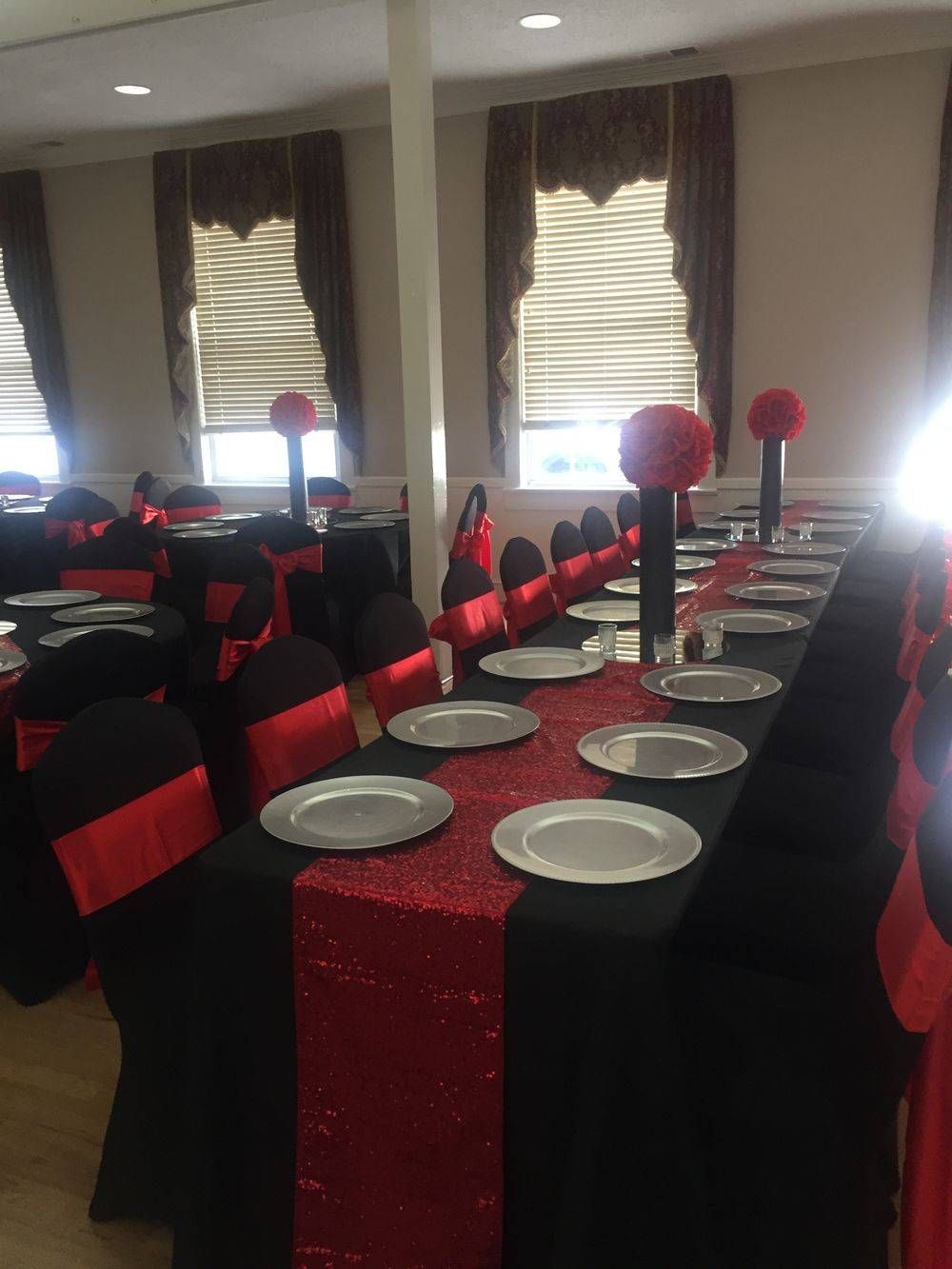 A long table with plates and vases on it