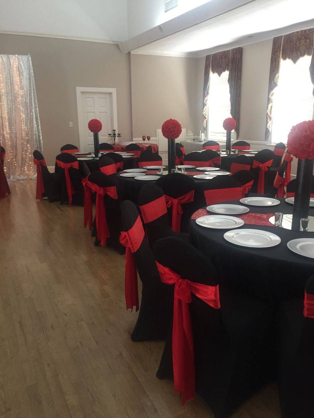A room with tables and chairs set up for a party