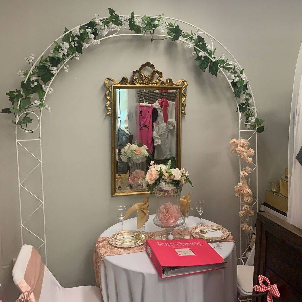 A room with a table and chairs and a mirror