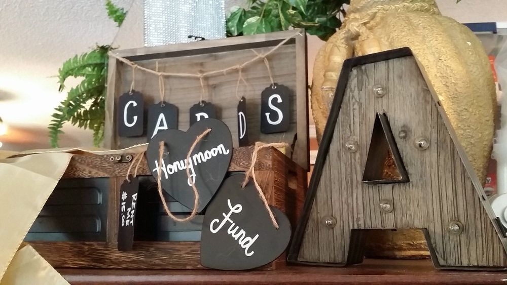 A wooden sign that says cards honeymoon fund