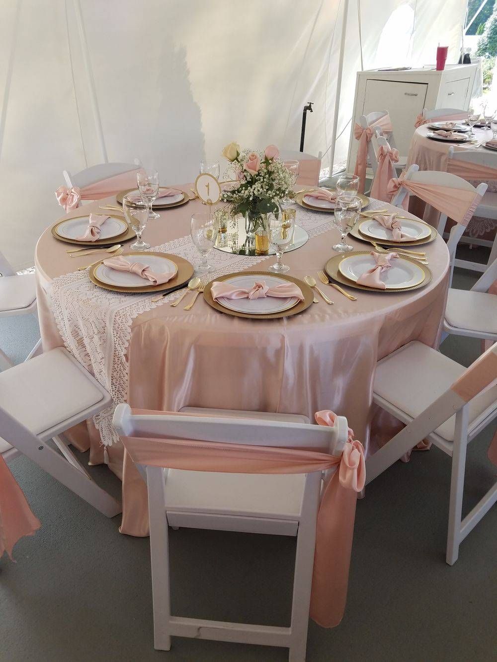 A table and chairs are set up for a wedding reception.