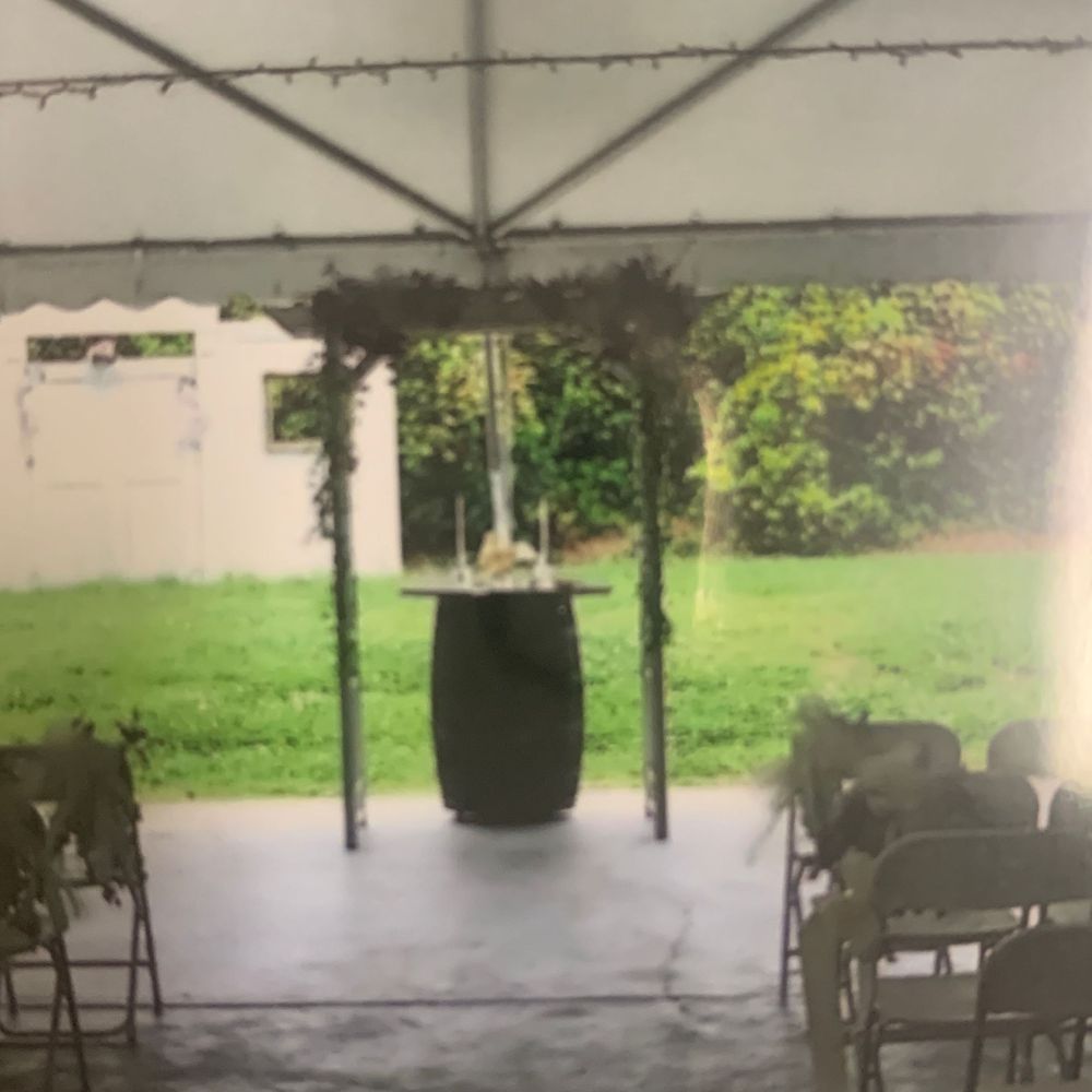 A tent with a barrel in the middle of it