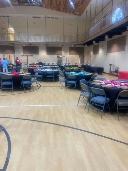 A large room with tables and chairs in it
