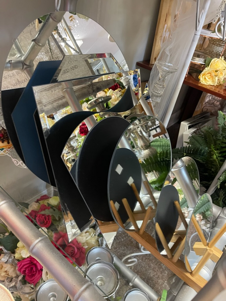 A bunch of mirrors are stacked on top of each other