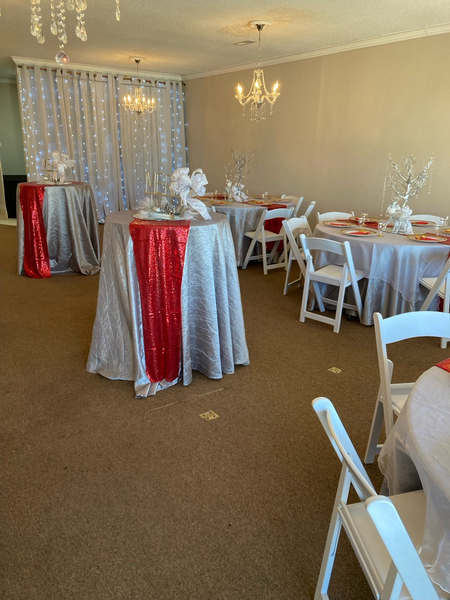 A room with tables and chairs set up for a party