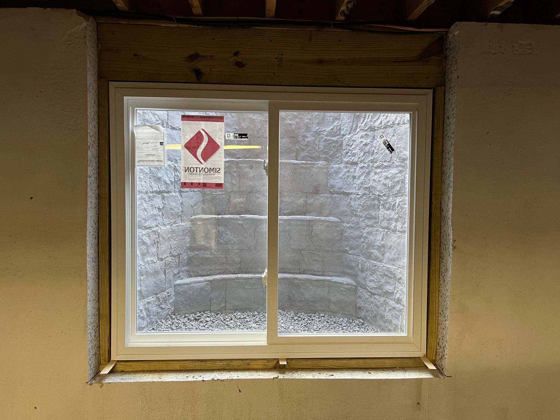 A window in a room with a sign that says ' a ' on it