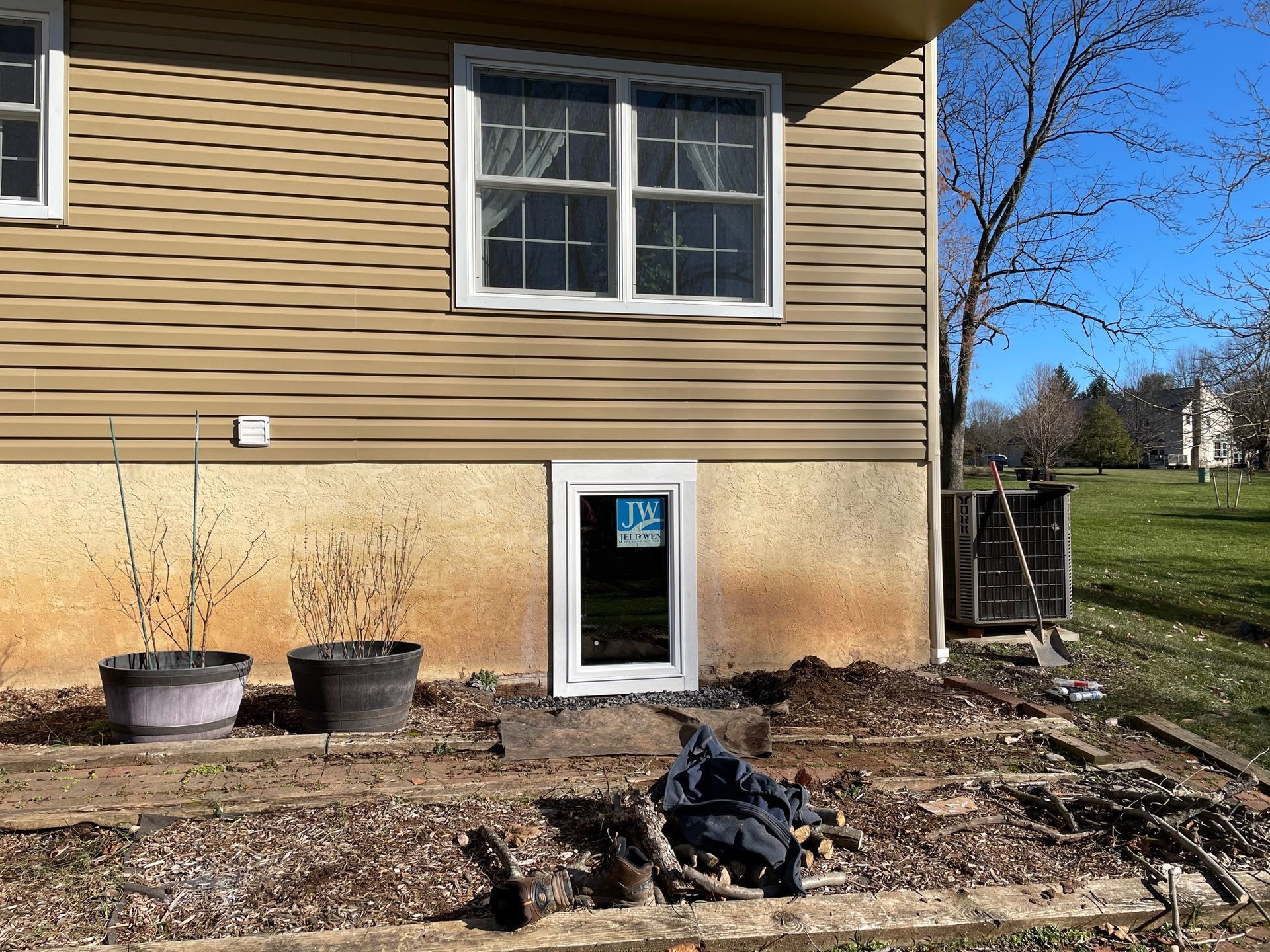 A house with a window on the side of it.