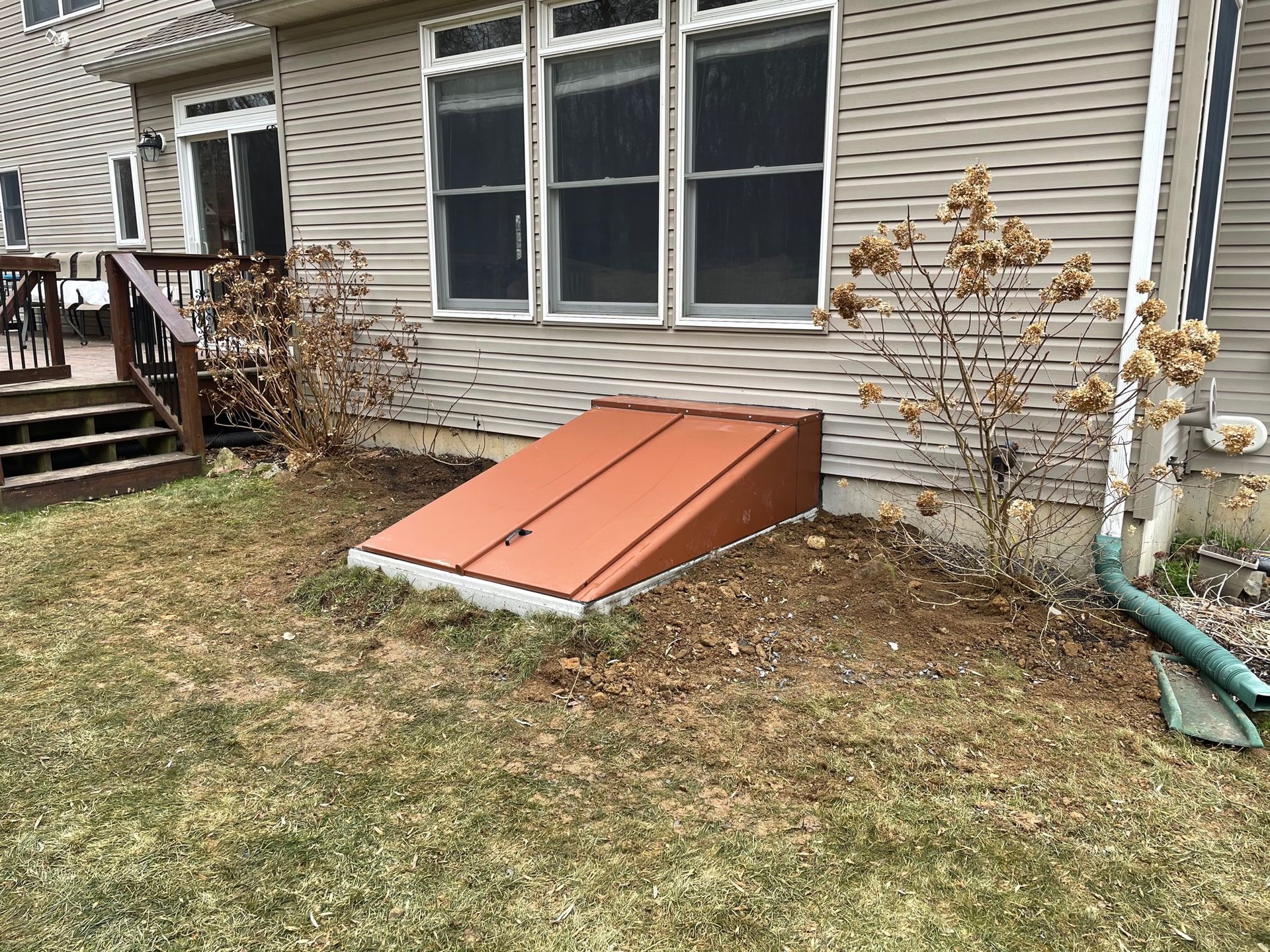 A house with a red door on the side of it.