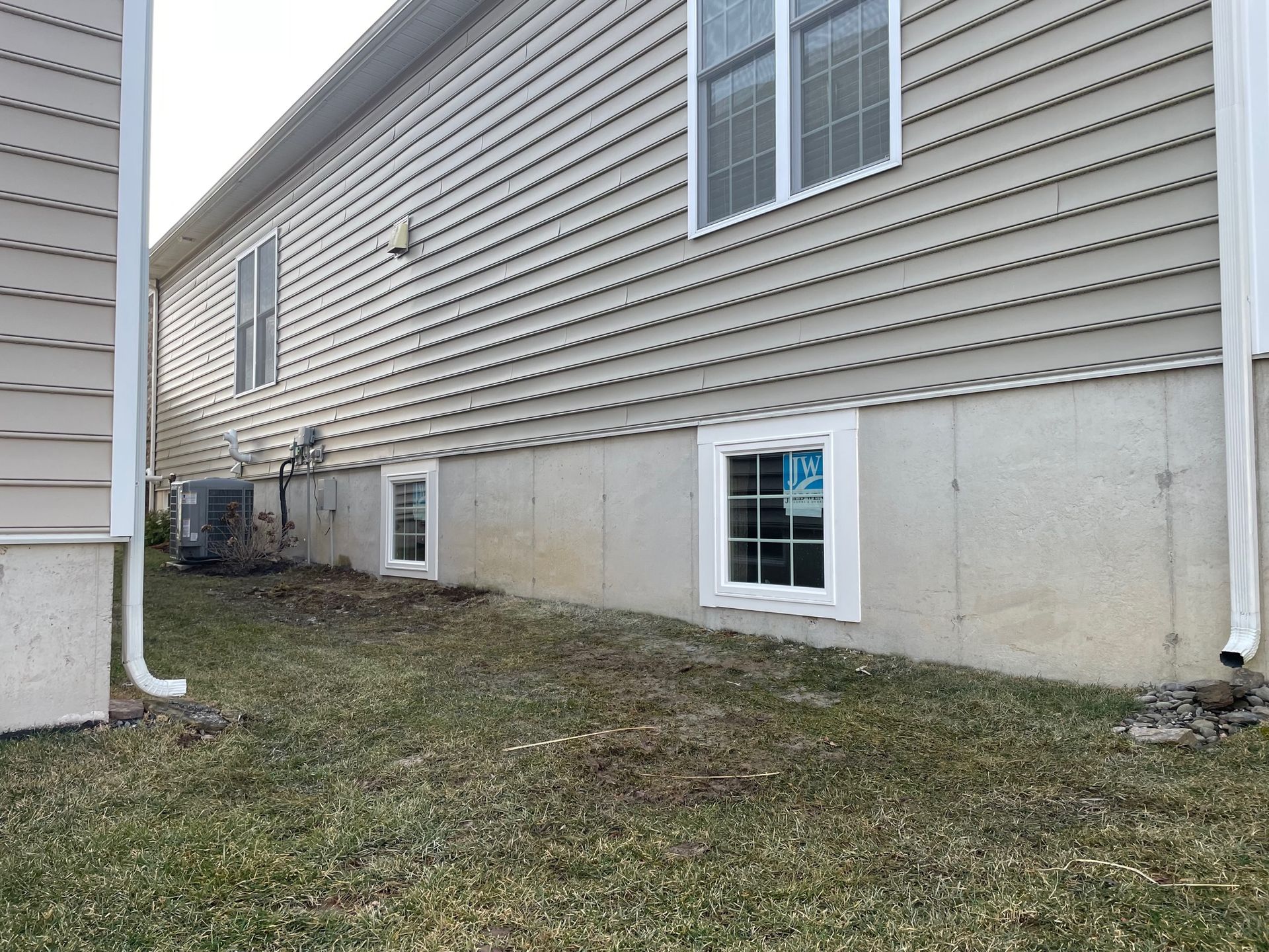 A house with a lot of windows on the side of it